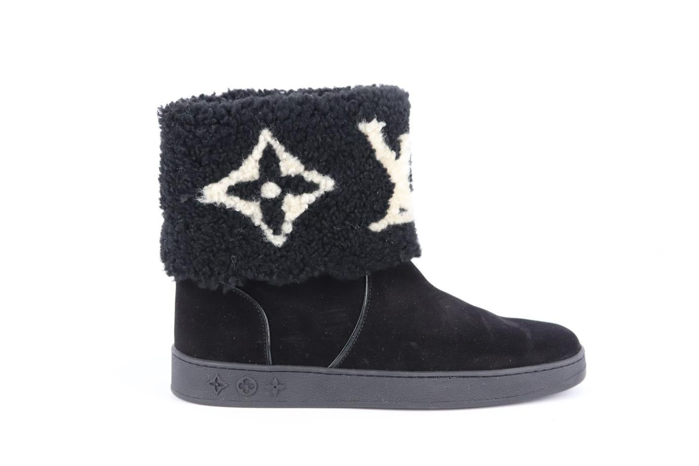 Louis Vuitton Snowdrop monogrammed shearling and suede ankle boots. Black and white. Pull on. Does not come with box or dustbag. Size: EU 38 (UK 5, US 8). Outersole: 10.6 in. Shaft: 6.4 in. Heel: 1.2 in. Very good condition - Worn once. Light wear