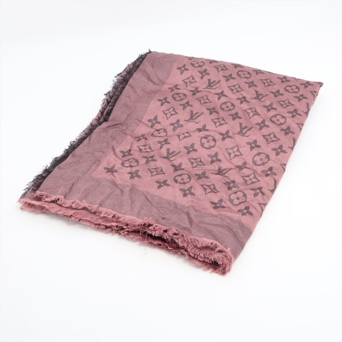 The Louis Vuitton So Shine Monogram Shawl in Purple is a luxurious and versatile accessory that adds a touch of elegance to any outfit. Crafted from a blend of silk and wool, the shawl features the iconic Louis Vuitton Monogram pattern in a vibrant