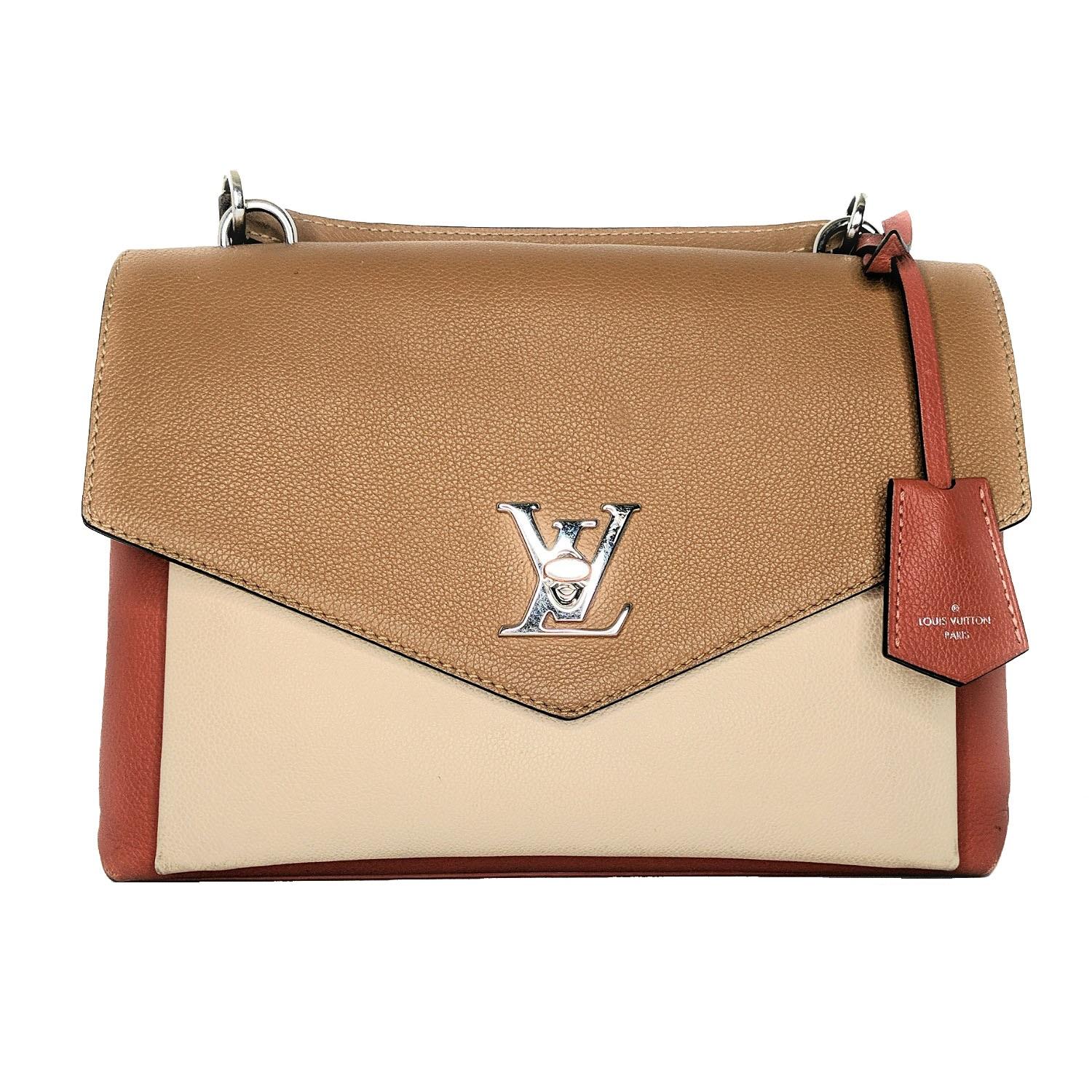 Louis Vuitton Mylockme with silver-tone hardware, single flat top handle, single detachable flat shoulder strap with buckle adjustment, single exterior zip pocket, single slit pocket under front flap, tonal Alcantara lining, three interior