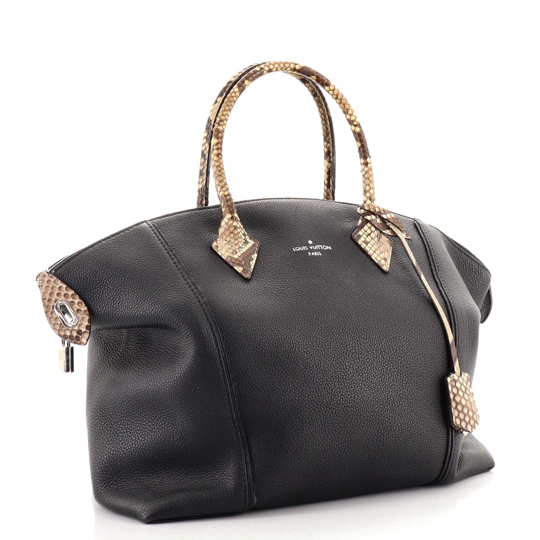 This item can only be shipped within the United States.

Condition: Good. Odor in interior. Creasing on exterior, wear on base corners and in interior, lifting of scales on handles, zipper pull and clochette. Heavy melting and indentations on handle