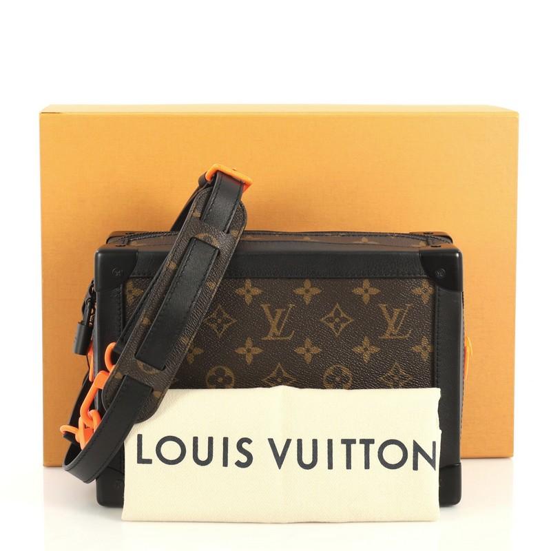 This Louis Vuitton Solar Ray Soft Trunk Bag Monogram Canvas, crafted from brown monogram coated canvas, features flat leather strap, leather trim, matte orange chain and black-tone hardware. Its zip closure opens to a black fabric interior with slip