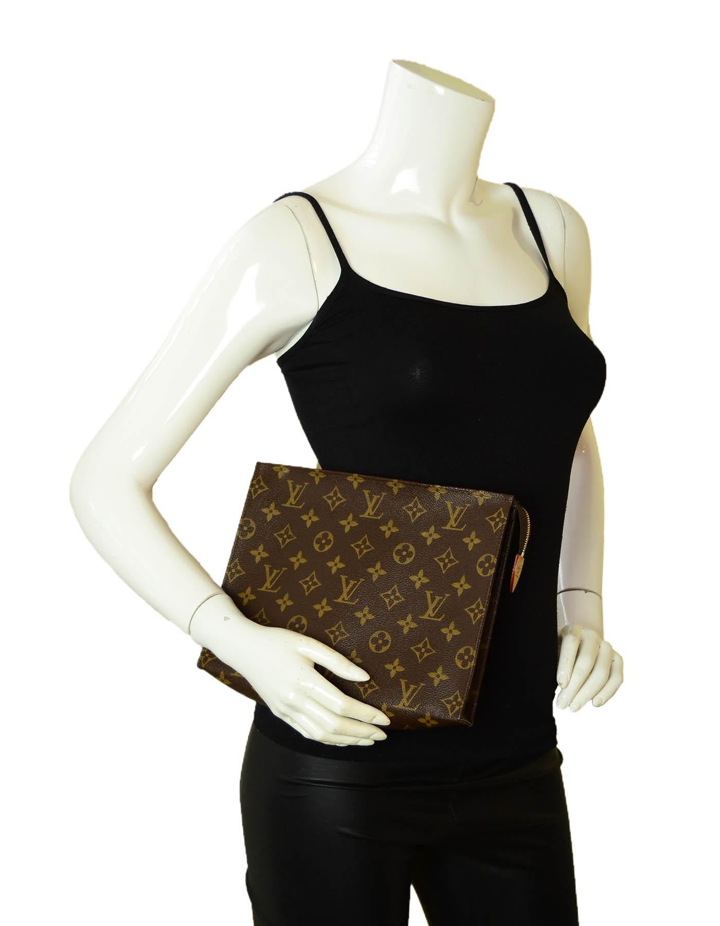 Louis Vuitton SOLD OUT Monogram Coated Canvas Toiletry 26 Pouch/Clutch Bag

Made In: France
Year of Production: 2015
Color: Brown
Hardware: Goldtone brass
Materials: Monogram coated canvas with vachetta leather
Lining: Beige washable