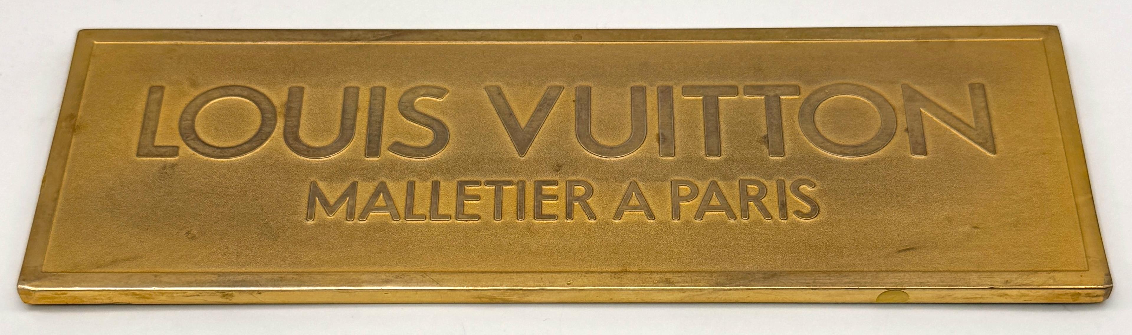 Louis Vuitton Solid Bronze and Gold-Plated Storefront Plaque, “Malletier à Paris”—Mid-20th Century

A rare and impressive Louis Vuitton architectural nameplate, cast in solid bronze with a gold-plated finish, featuring the iconic engraving “LOUIS