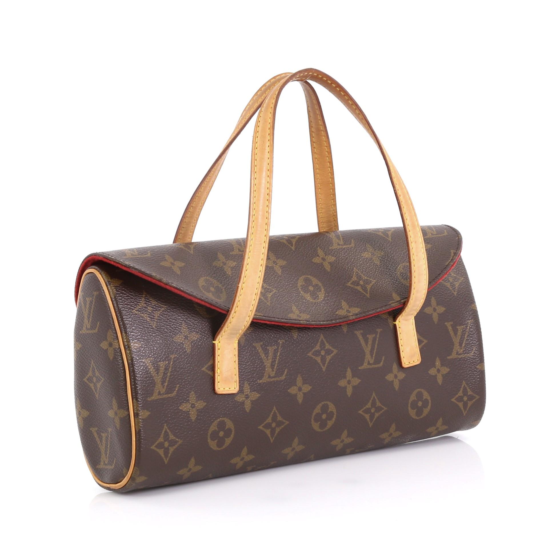 This Louis Vuitton Sonatine Monogram Canvas, crafted from brown monogram coated canvas, features dual flat vachetta leather handles, vachetta leather trim, and gold-tone hardware. Its flap with hidden magnetic snap closure opens to a red microfiber
