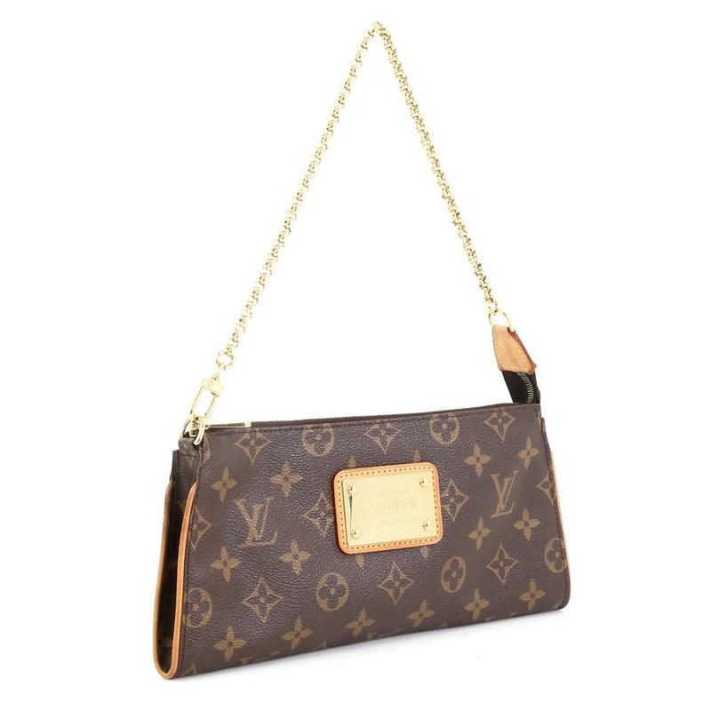 This Louis Vuitton Sophie Crossbody Monogram Canvas, crafted from brown monogram coated canvas, features natural vachetta leather trim, wrist chain strap, and gold-tone hardware. Its top zip closure opens to a brown fabric interior. Authenticity