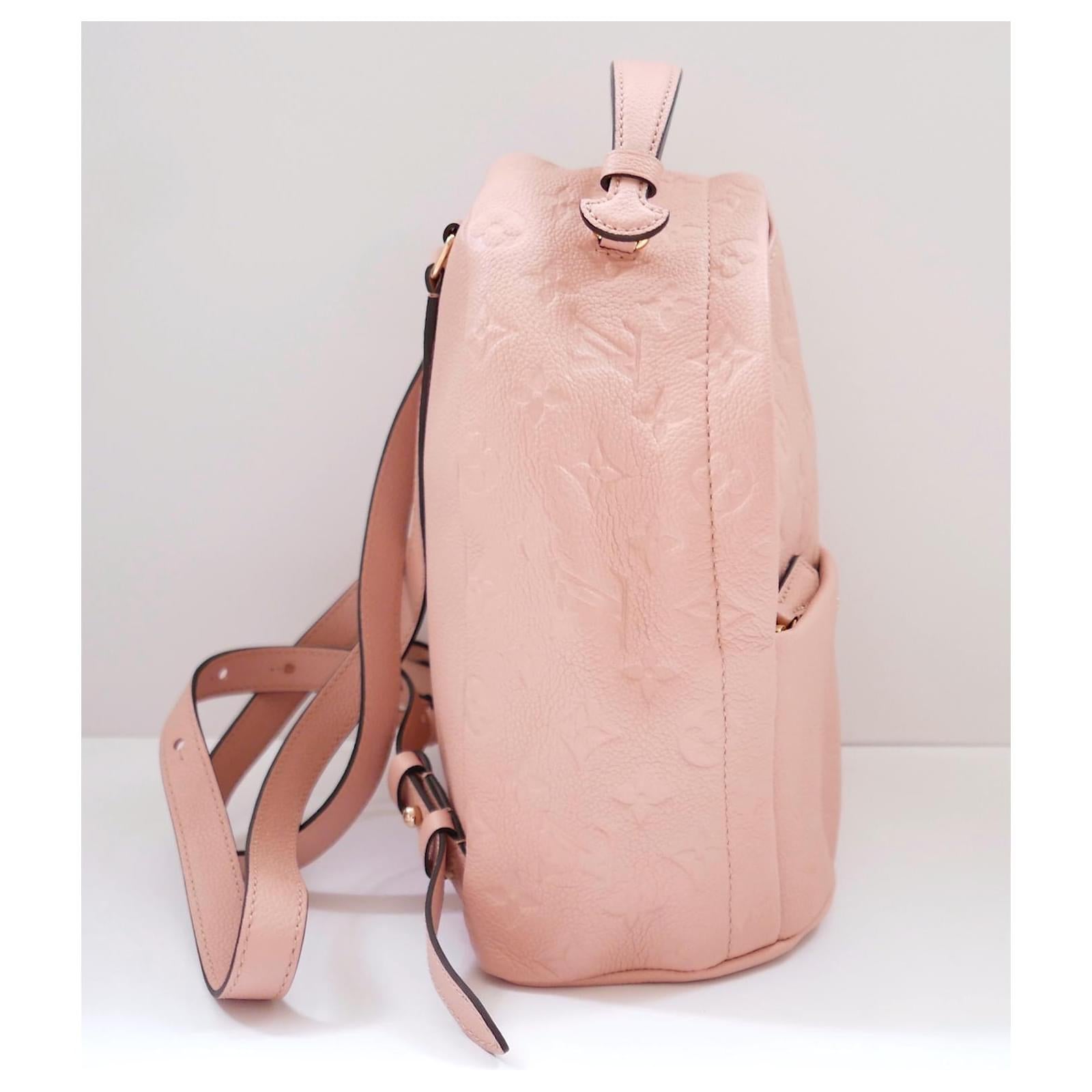 Adorable Louis Vuitton Sorbonne backpack - used once and comes with dustbag, care leaflet and sticker tag. Made from candy pink Monogram Empreinte leather, it has brass hardware, dual adjustable straps, front pocket and pink striped cotton lining.