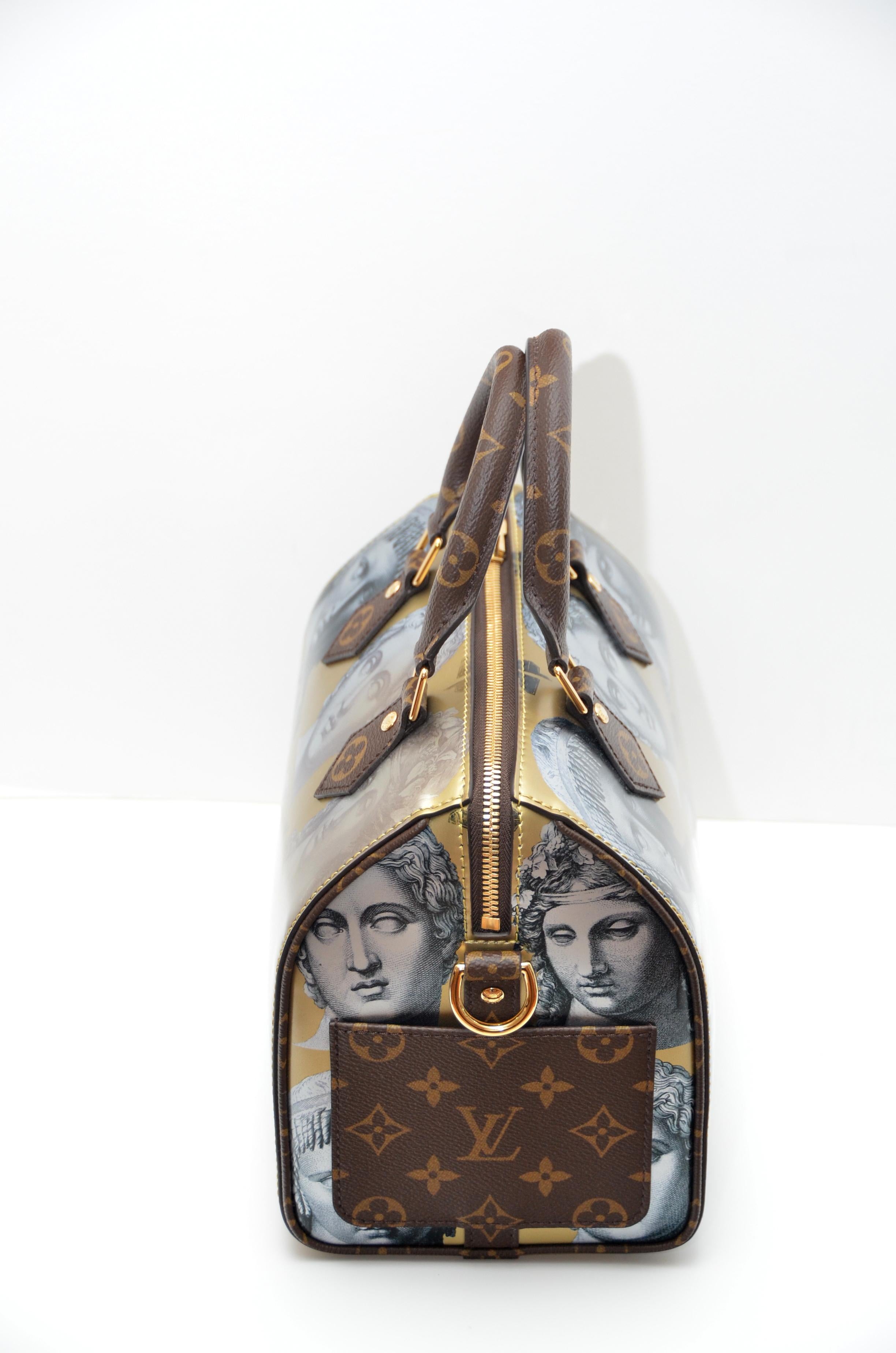 
Louis Vuitton Speedy 25 Fornasetti Gold Metallic Leather Bag 
100% guaranteed Authentic LV 
New with tags 
Bag dimensions are 9.8 bottom length  x 7.5 x 5.9 inches 
Comes With:
LV Box, LV Purchase Receipt, LV Protection Bag,LV Locker
LV Bandouliere
