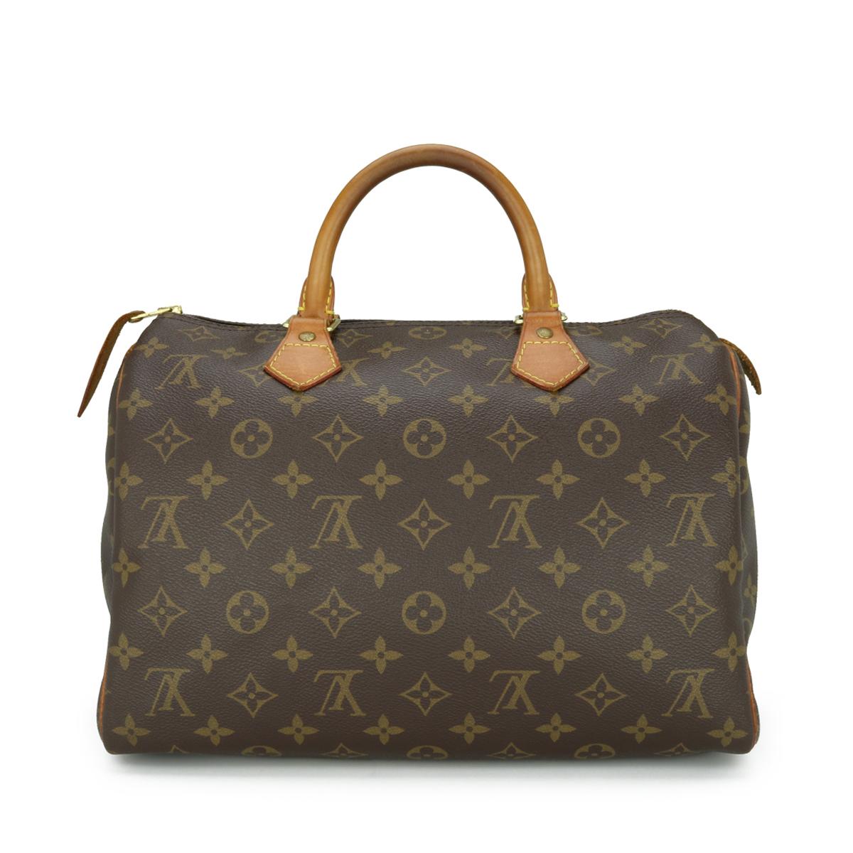 Louis Vuitton Speedy 30 Bag in Monogram 2011.

This bag is in good condition. 

- Exterior Condition: Good condition. Light storage creasing to the canvas. The outside of the bag shows signs of wear - leather/print surface rubbing to four base