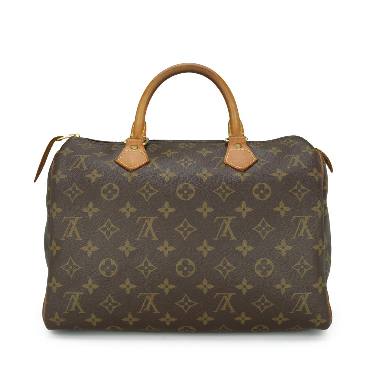 Louis Vuitton Speedy 30 Bag in Monogram 2011.

This bag is in good condition. 

- Exterior Condition: Good condition. Light storage creasing to the canvas. The outside of the bag shows signs of wear - leather/print surface rubbing to four base