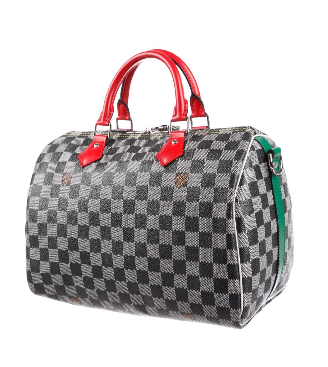 Coated canvas
Patent leather
Gold tone hardware
Zipper closure
Woven lining 
Handle drop 3.5