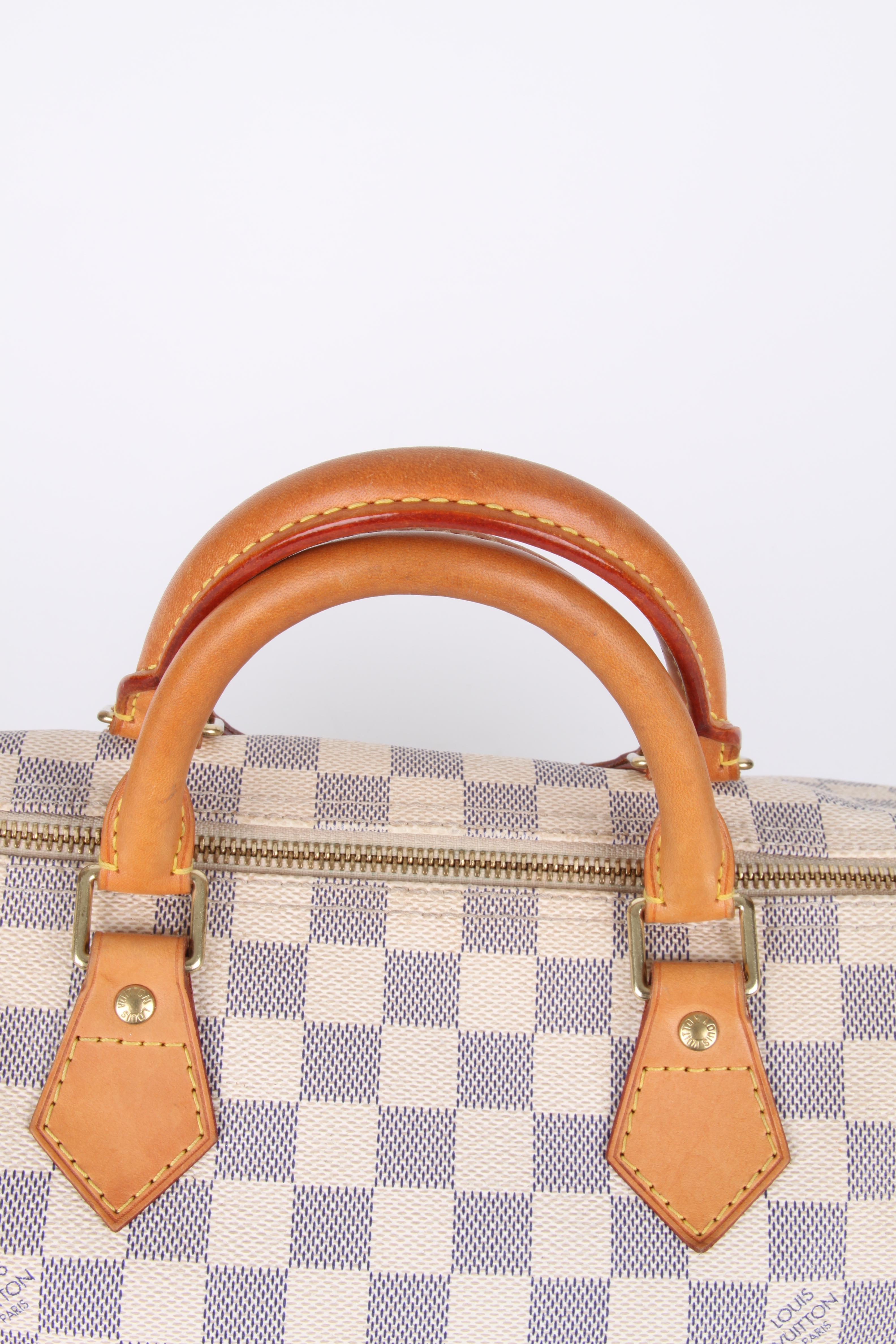 Louis Vuitton Speedy 30 Damier Azur Canvas Bag.

Fashioned from luminous Damier Azur canvas, the Speedy 30 is an elegant, compact handbag, a stylish companion for city life. Launched in 1930 as the 
