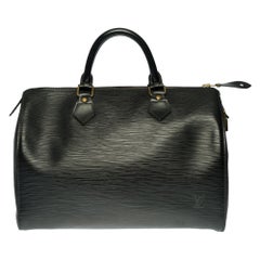 Louis Vuitton Speedy 30 handbag in black épi leather and gold hardware