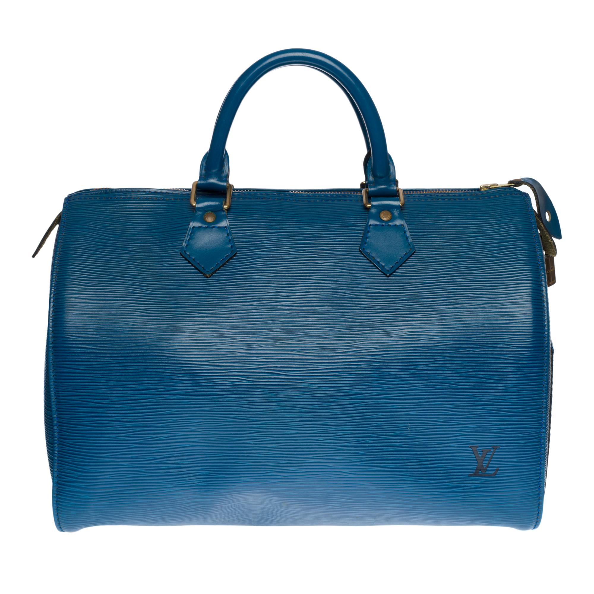 Prächtige Louis Vuitton Speedy 30 Handtasche aus blauem Epi-Leder, vergoldete Metallbeschläge, doppelter blauer Ledergriff zum Tragen in der Hand
Reißverschluss
Eine aufgesetzte Seitentasche
Interieur aus blauem Wildleder
Unterschrift: 