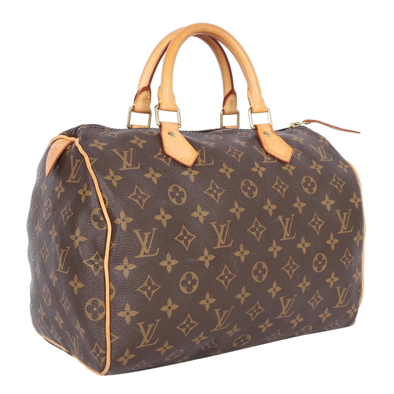 Authentic Louis Vuitton monogram Speedy 30 satchel. This Speedy is a classic and stylish day to evening bag for city life or traveling. Features monogram canvas, dual leather handles, zipper top closure, brown textile interior lining with a slip