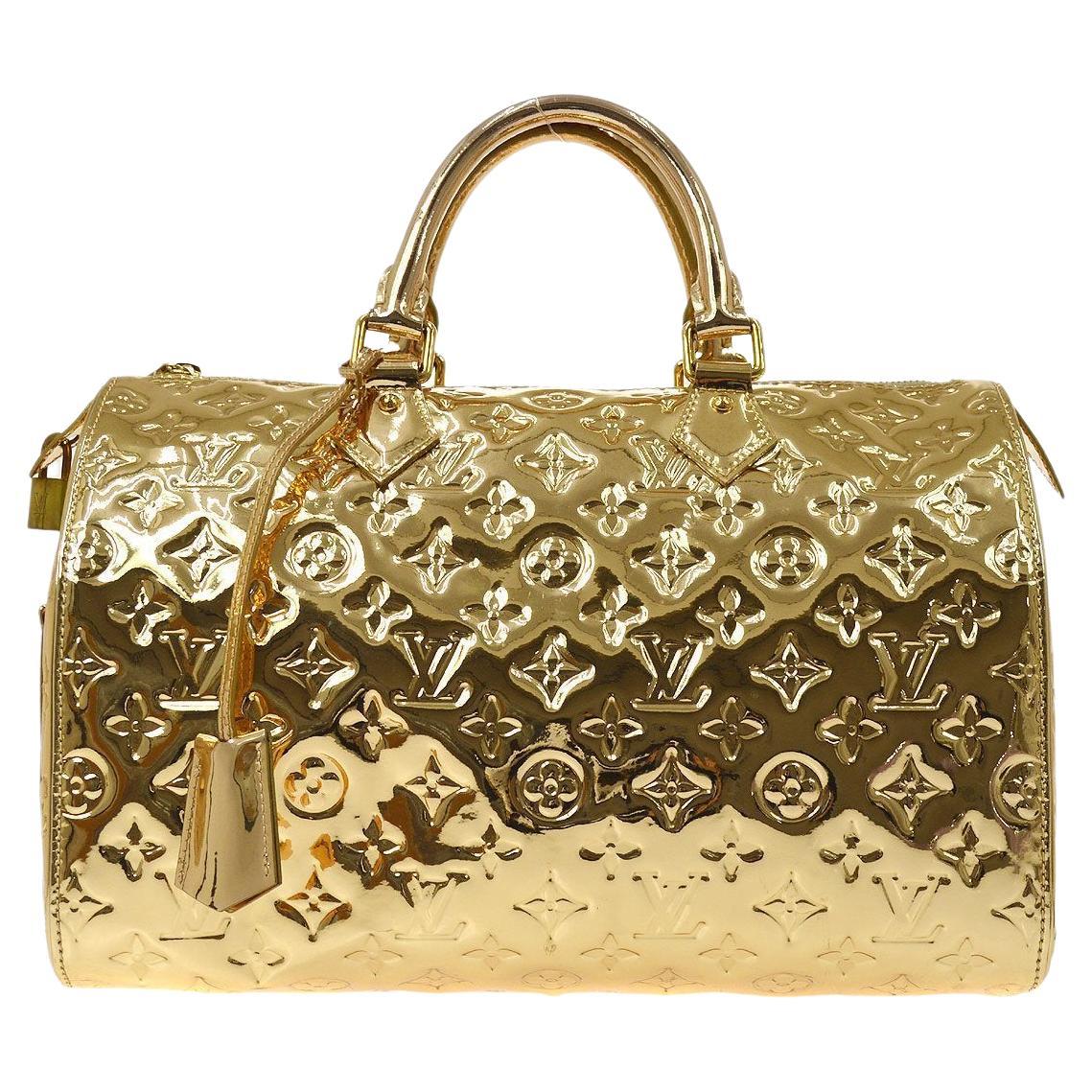 Sold at Auction: Louis Vuitton Gold Mirror Patent Leather Speedy 30