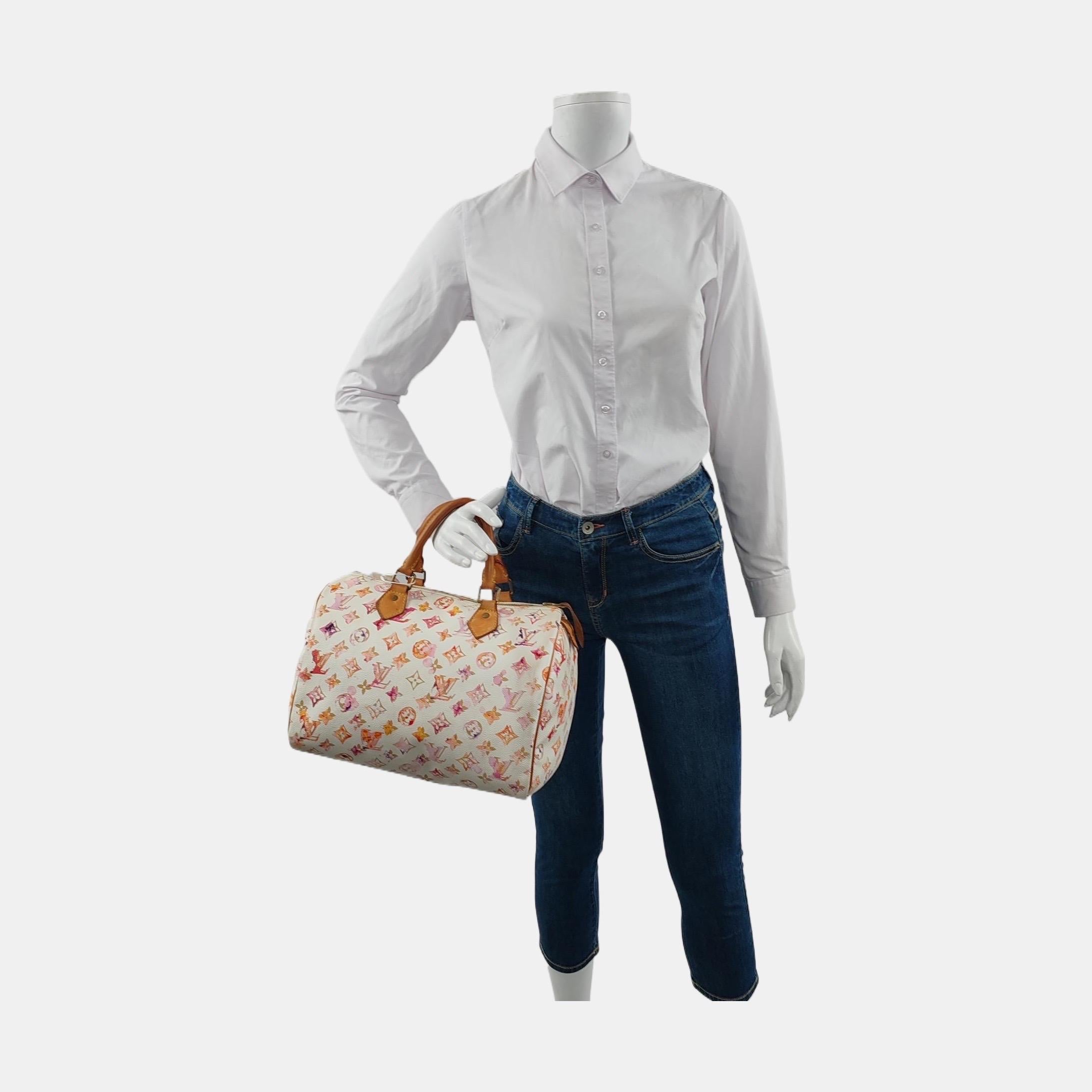 Seize the opportunity to own this exceptional limited edition from Louis Vuitton’s Spring/Summer 2008 runway collection. The Speedy 30 Monogram Watercolor Pink handbag offers generous space and urban sophistication. Crafted from the iconic monogram