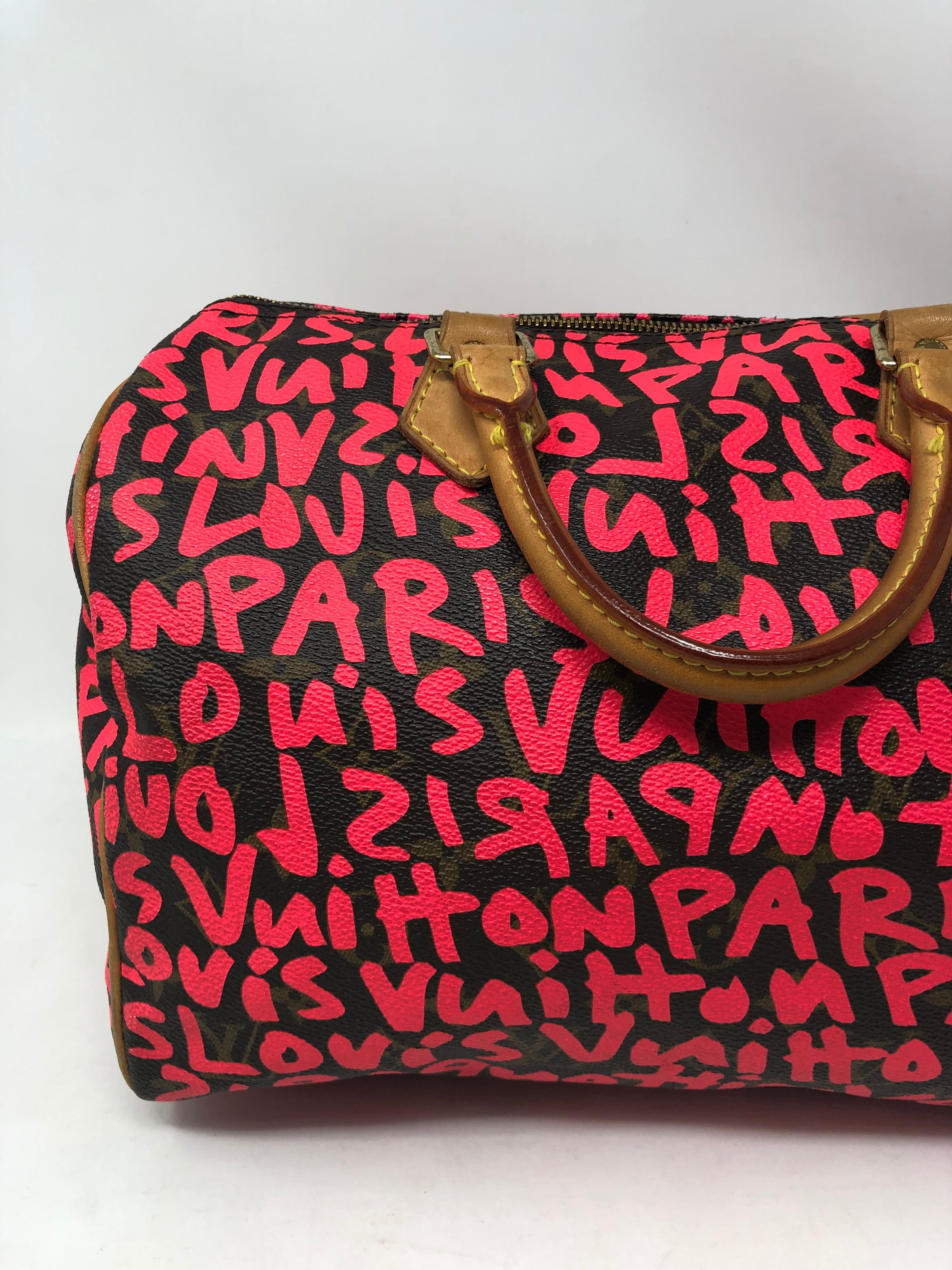 Louis Vuitton Speedy 30 designed by Stephen Sprouse. Iconic Graffiti Bag. Hot pink LV graffiti over monogram coated canvas. A classic meets rebellion. Don't miss out on this one. Guaranteed authentic. 