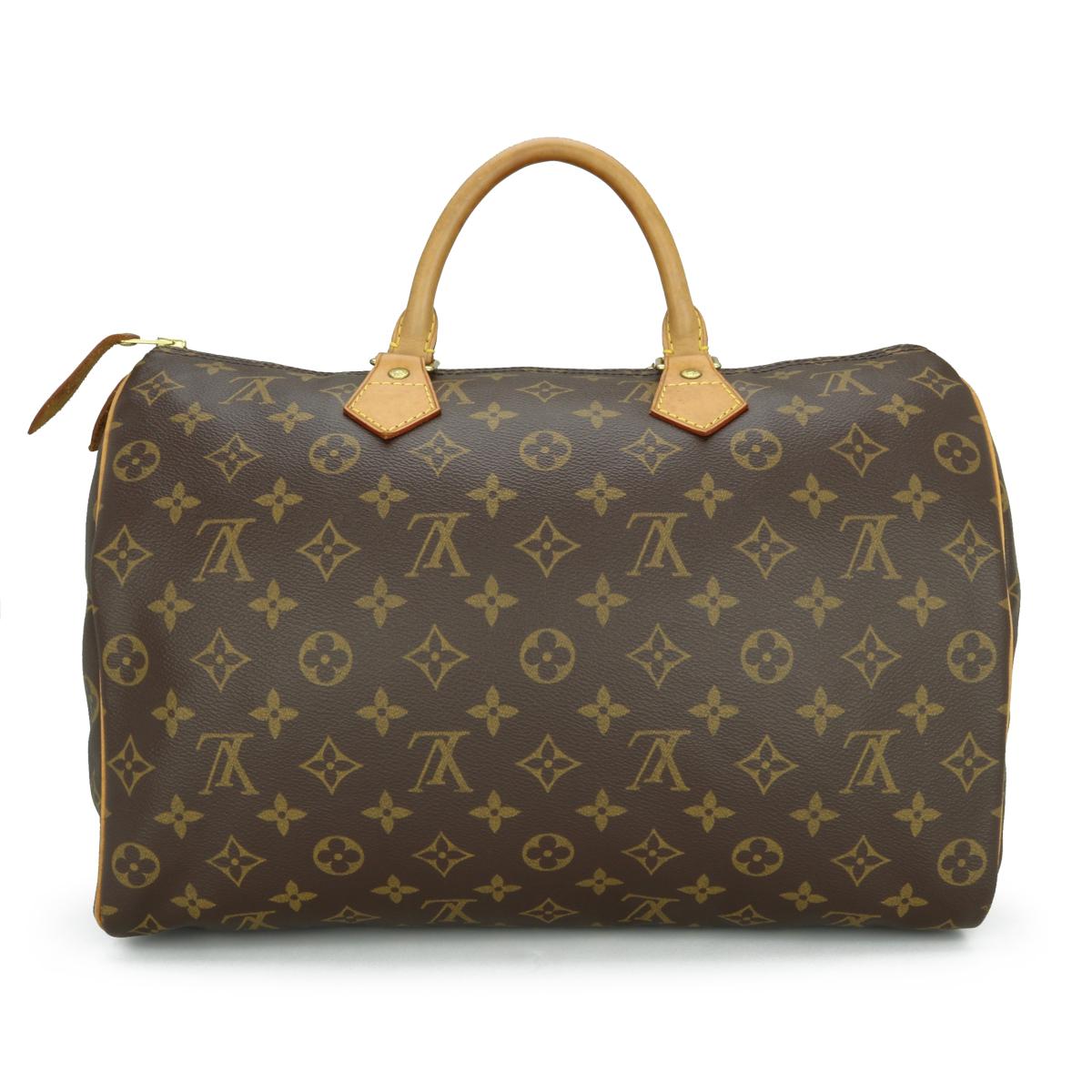 Louis Vuitton Speedy 35 Bag in Monogram 2005.

This bag is in good condition. 

- Exterior Condition: Good condition. Light storage creasing to the canvas. The outside of the bag shows signs of wear - leather/print surface rubbing to four base