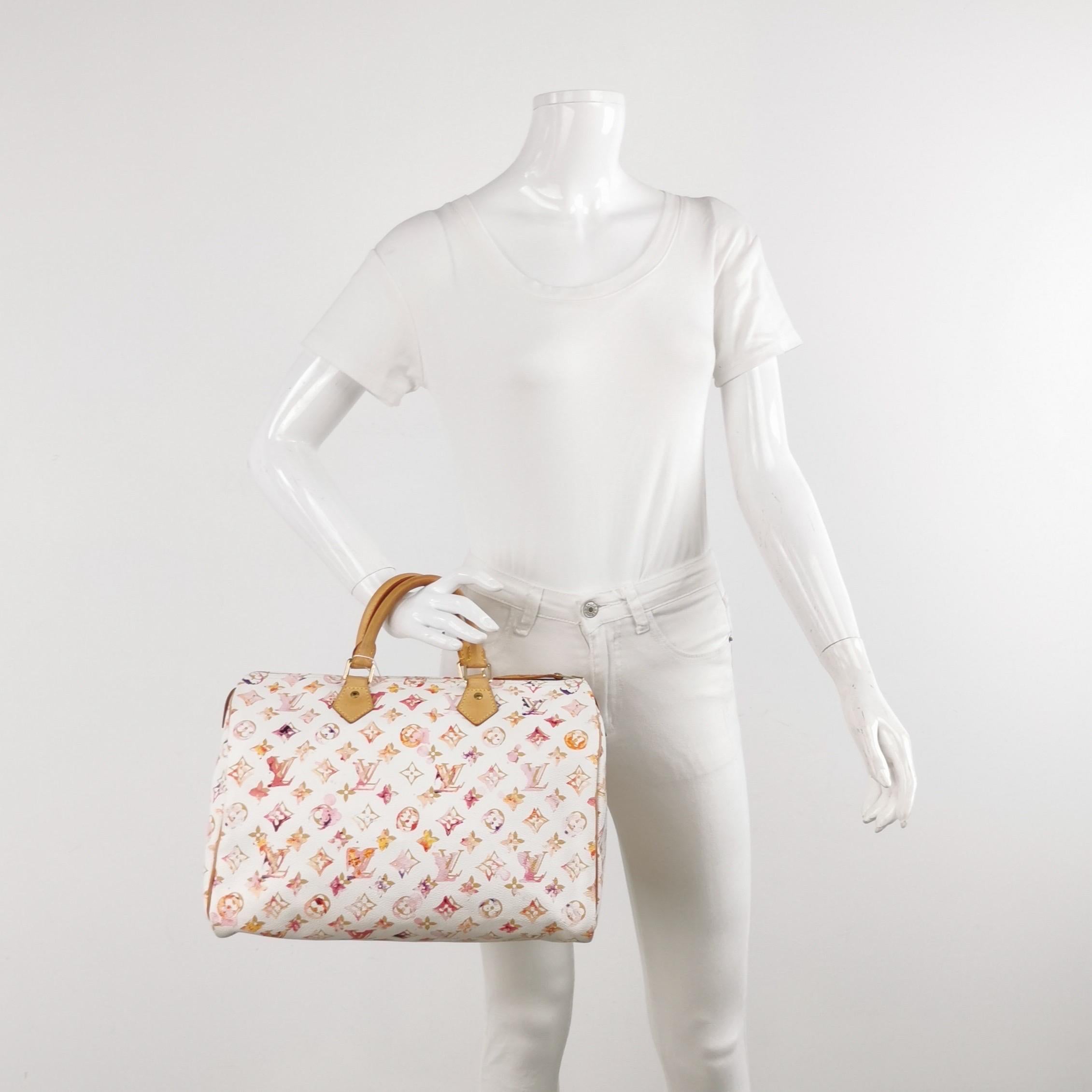 Seize the opportunity to own this exceptional limited edition from Louis Vuitton’s Spring/Summer 2008 runway collection. The Speedy 30 Monogram Watercolor Pink handbag offers generous space and urban sophistication. Crafted from the iconic monogram