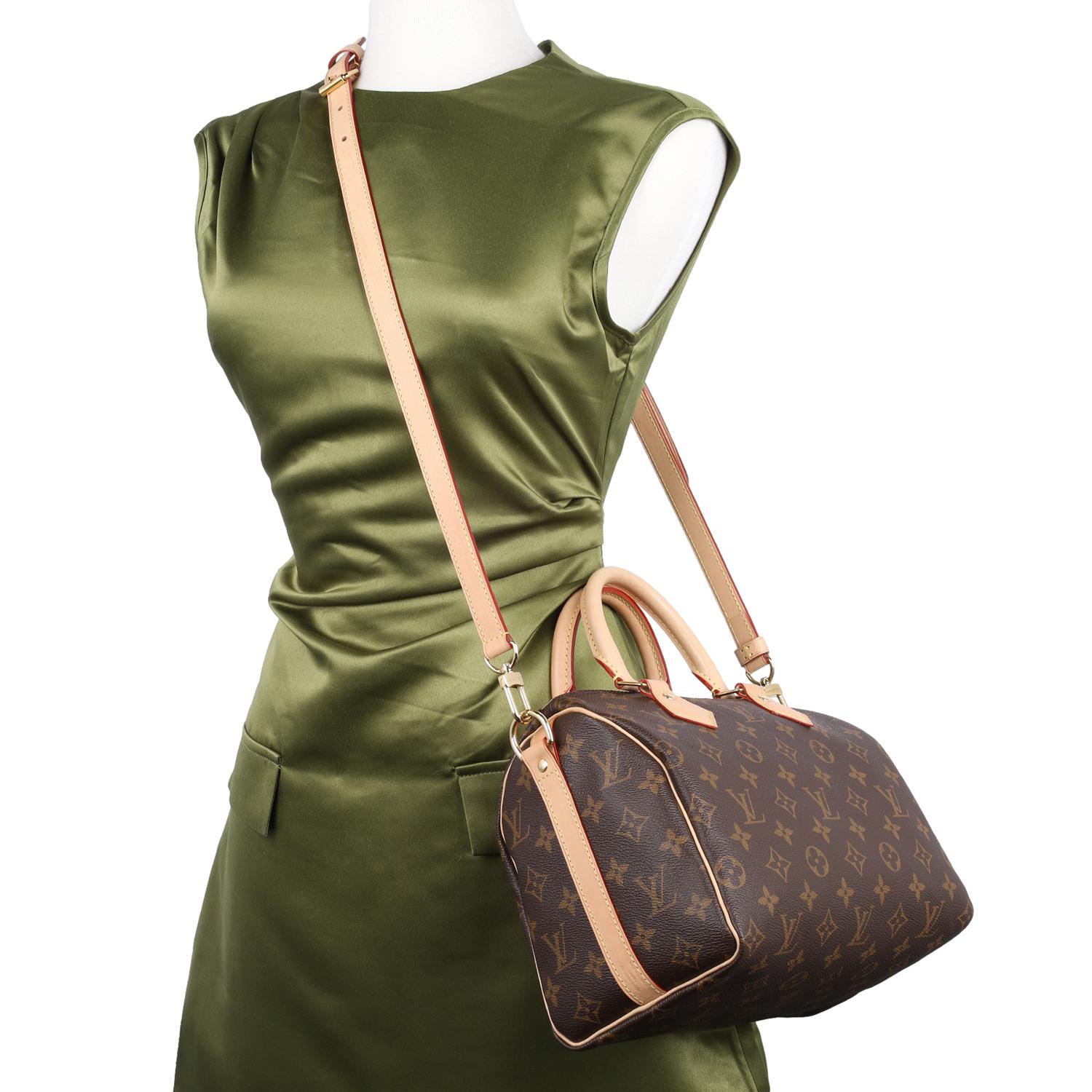 Authentic, pre-owned Louis Vuitton Speedy Bandouliere 25 in brown monogram.

Features: Monogram Canvas with Leather trim, Brown interior lining with zipper patch pocket, Double handles, and Zip top closure.

Made in France

RFID Chip

Strap Drop: