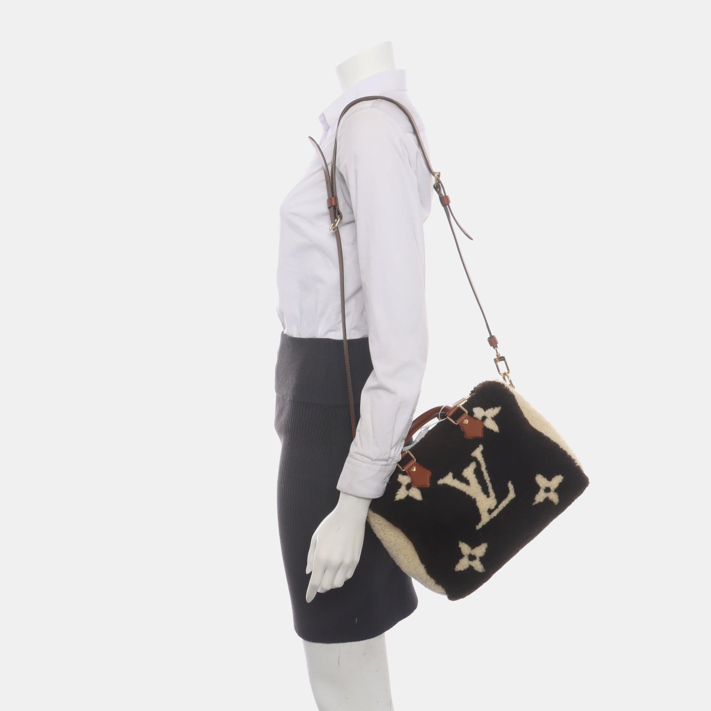 Louis Vuitton Speedy Bandouliere 25 Teddy Shearling Giant Monogram Crossbody Bag
 These are professional photos of the actual bag .
 CONDITION: NEVER WORN
 
 
 
 
 DETAILS:
 
 Louis Vuitton
 Speedy 25
 Leather and shearling
 
 Color: Dark brown
