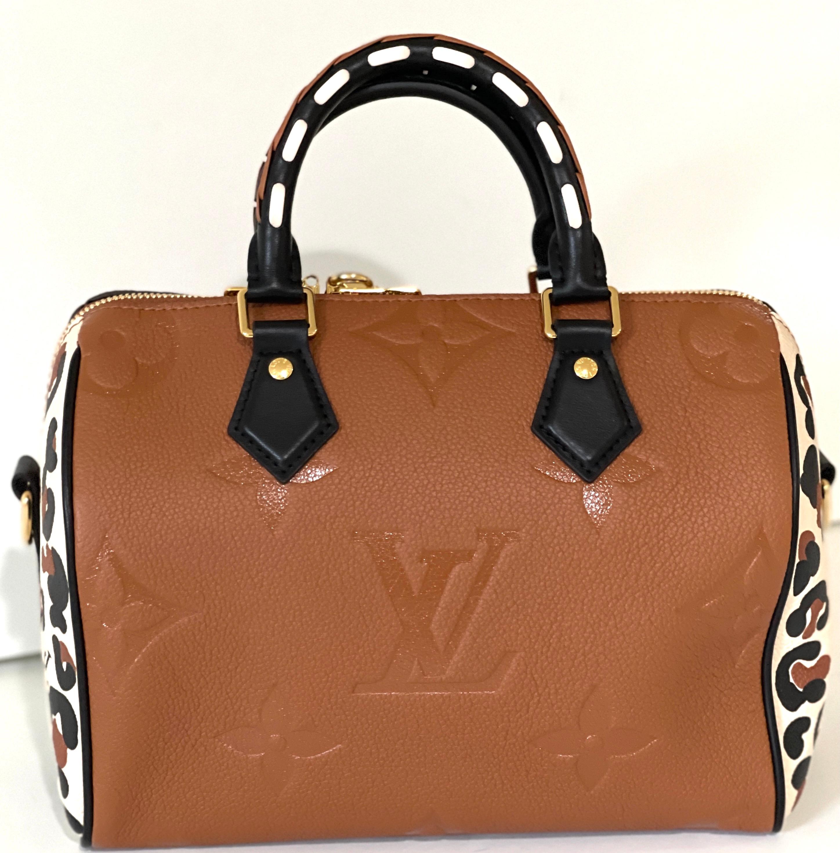Louis Vuitton 
Soldout Immediately!
Speedy Bandouliere 25 
Wild at Heart
Leopard
Caramel color, with black handles
Leopard on sides
Gold Hardware
9.8 x 7.5 x 5.9 inches
(length x Height x Width)
Caramel
Embossed supple grained cowhide leather
Supple