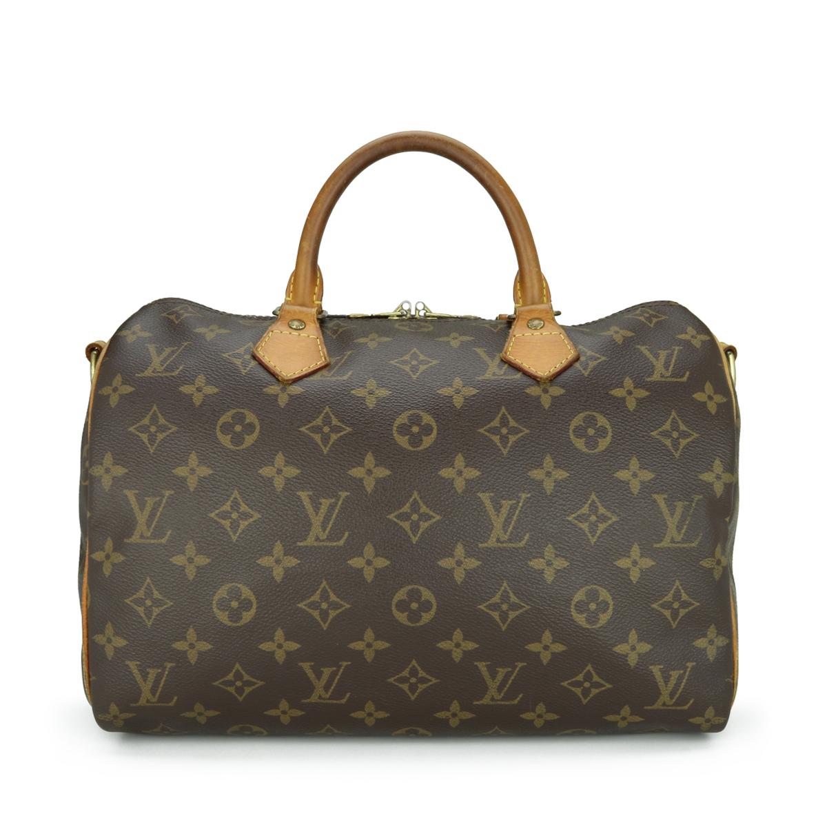 Louis Vuitton Speedy Bandoulière 30 Bag in Monogram 2013.

This bag is in good condition. 

- Exterior Condition: Good condition. Light storage creasing to the canvas. The outside of the bag shows signs of wear - leather/print surface rubbing to