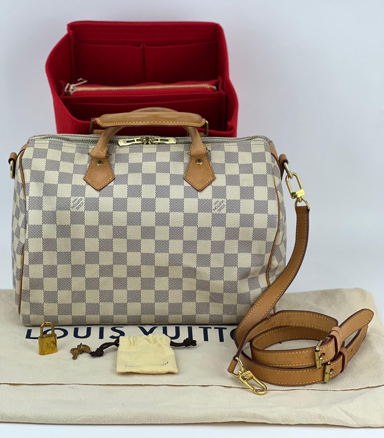 Pre-Owned  100% Authentic
Louis Vuitton damier Azur Speedy Bandouliere 30
W/added insert to help keep its shape and organize
RATING  B  very good, well maintained, shows 
minor signs of wear
MATERIAL: damier azur, leather trim
LEATHER TRIM: has some