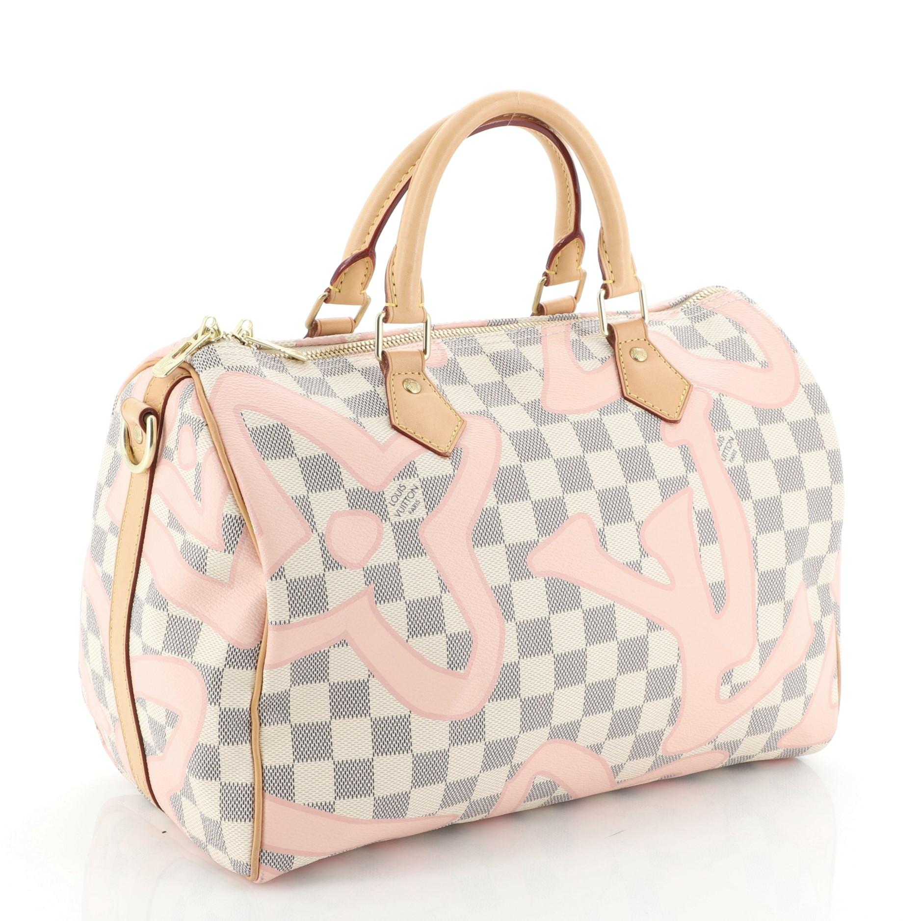 Condition: Very good. Minor wear on base corners, slight discoloration on exterior, darkening, scuffs and watermarks on handles, strap and leather trims. Stains in interior, scratches on hardware. 
Accessories: With Strap 
Measurements: Handle Drop