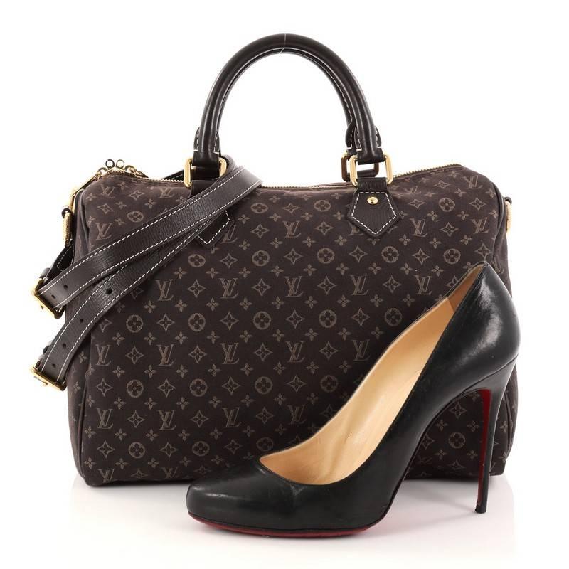 This authentic Louis Vuitton Speedy Bandouliere Bag Monogram Idylle 30 is a sporty must-have. Constructed from Louis Vuitton's brown monogram idylle canvas, this fresh Speedy features dual rolled top handles, and gold-tone hardware accents. The