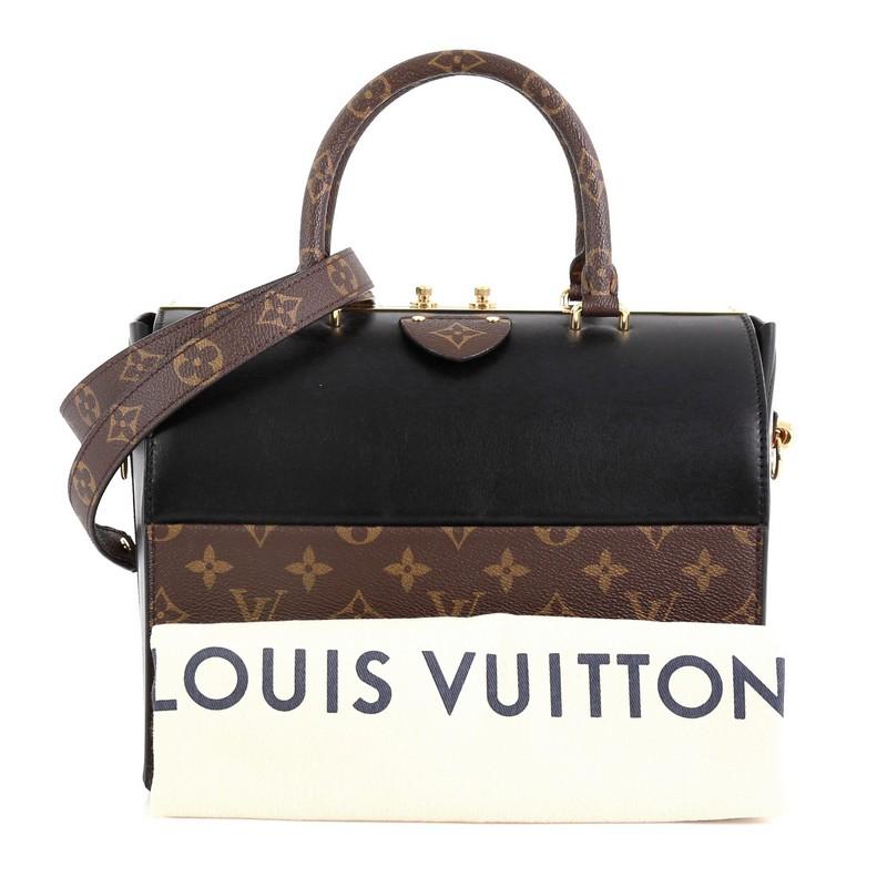 This Louis Vuitton Speedy Doctor Bag Monogram Canvas and Leather 25, crafted in brown monogram coated canvas and black leather, features dual-rolled monogram handles, detachable strap and gold-tone hardware. Its clasp closure opens to a black