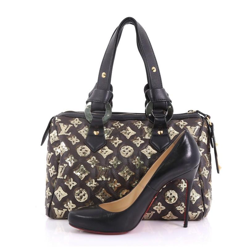 This Louis Vuitton Speedy Handbag Limited Edition Monogram Eclipse Sequins 28, crafted from brown monogram eclipse gold sequins, features leather handles with end knots, giant graphic eyelet accents and silver and gold-tone hardware. Its top zip
