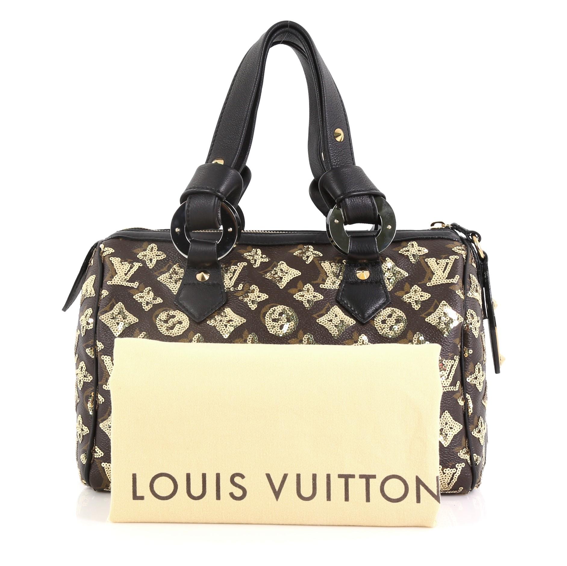 This Louis Vuitton Speedy Handbag Limited Edition Monogram Eclipse Sequins 28, crafted from brown monogram eclipse sequins, features leather handles with end knots, graphic eyelet accents, and gold-tone hardware. Its zip closure opens to a black