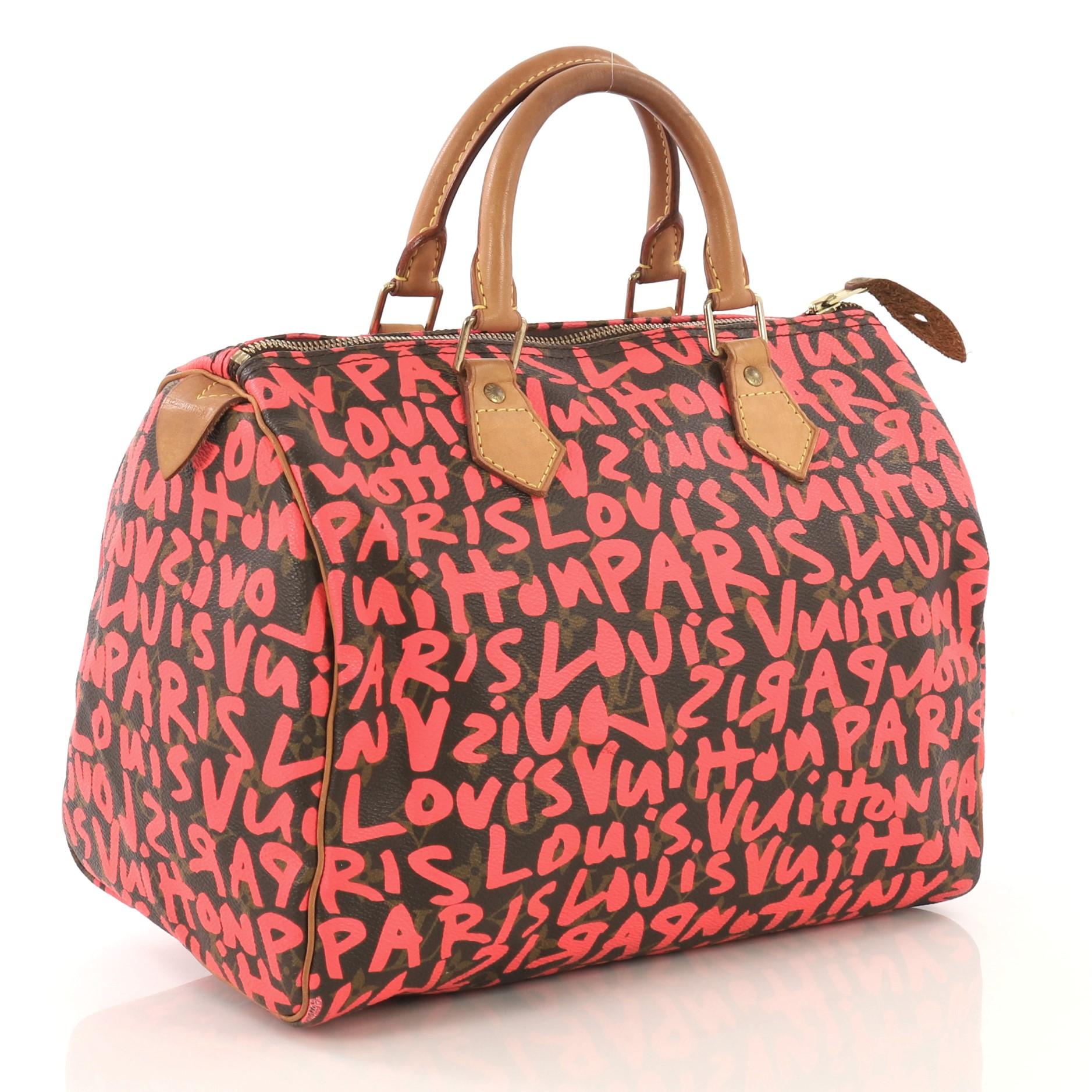 This Louis Vuitton Speedy Handbag Limited Edition Monogram Graffiti 30, crafted from brown monogram coated canvas with pink graffiti print by Stephen Sprouse, features cowhide leather handles and trim, and gold-tone hardware. Its zip closure opens