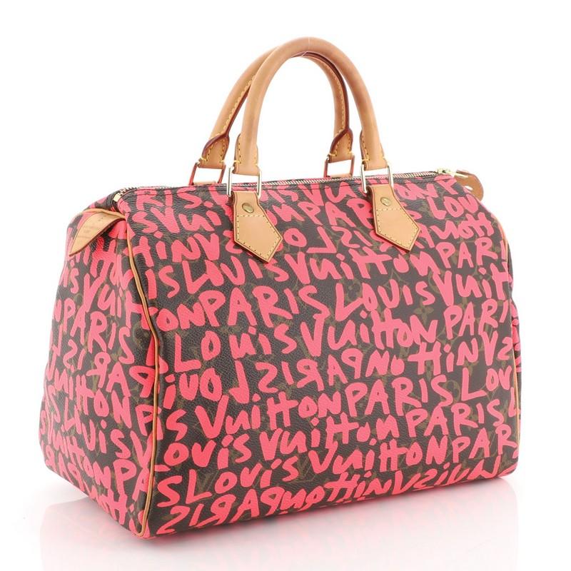 This Louis Vuitton Speedy Handbag Limited Edition Monogram Graffiti 30, crafted from brown monogram coated canvas with pink graffiti print by Stephen Sprouse, features cowhide leather handles and trim, and gold-tone hardware. Its zip closure opens