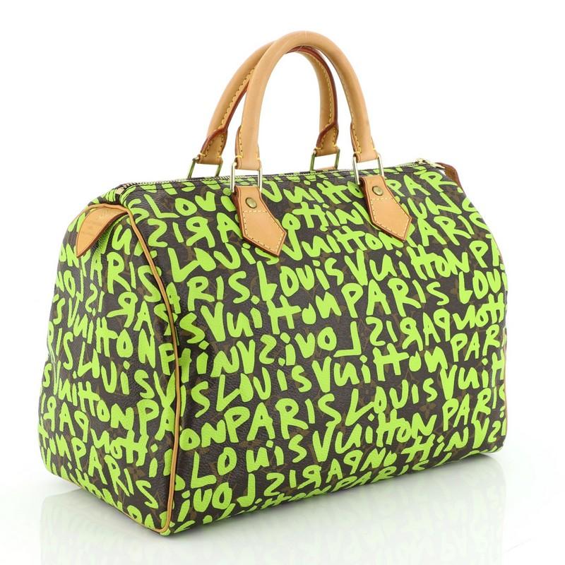 This Louis Vuitton Speedy Handbag Limited Edition Monogram Graffiti 30, crafted from brown monogram coated canvas with green graffiti print by Stephen Sprouse, features cowhide leather handles and trim, and gold-tone hardware. Its zip closure opens