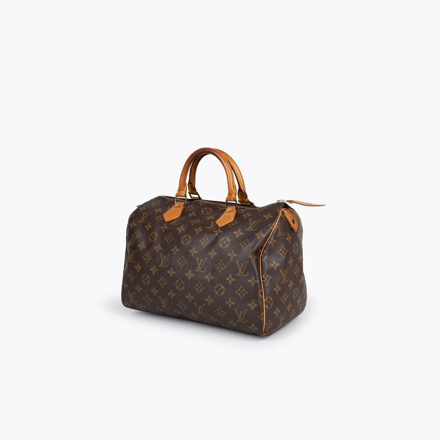 Brown and tan monogram coated canvas Louis Vuitton Speedy 30 with

- Brass hardware
- Tan vachetta trim
- Dual rolled top handles
- Brown canvas interior
- Single interior slit pocket and zip closure at top

Overall Preloved Condition: Very