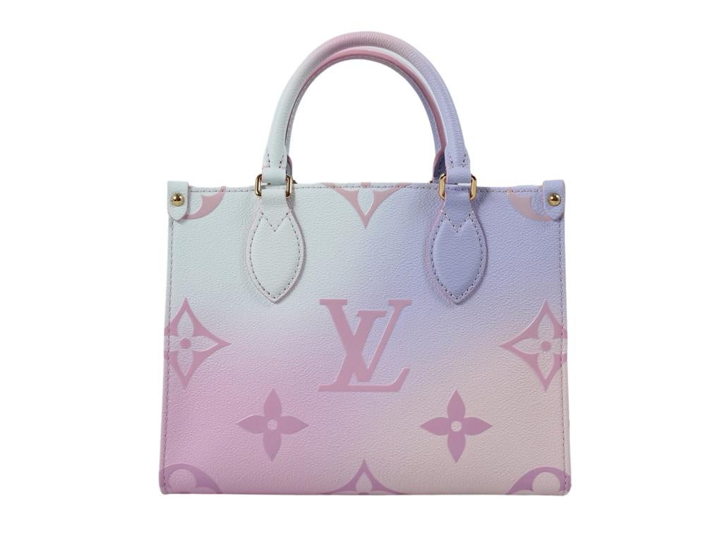This chic handbag is part of the Louis Vuitton Spring 2022 “Spring in the City” collection. This limited edition tote features oversized versions of the classic Louis Vuitton monogram canvas in pastel shades of pink and blue. This bag was purchased