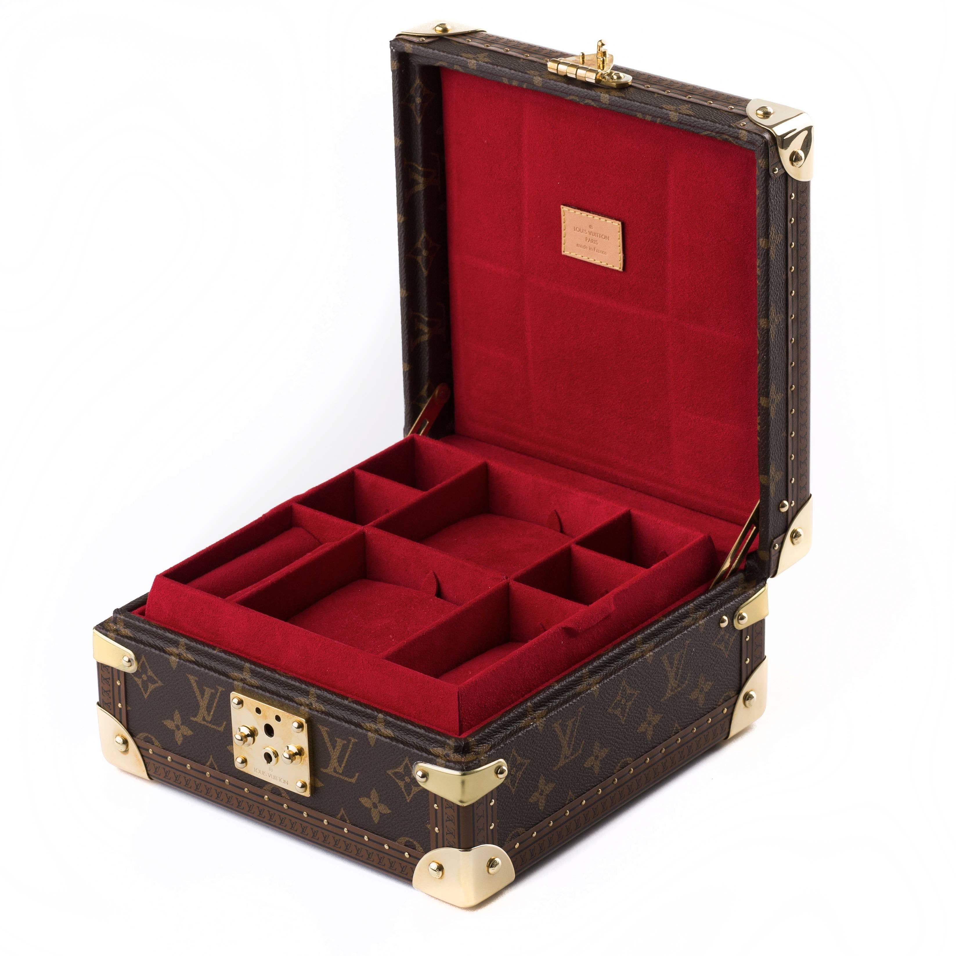 Beautiful Louis Vuitton jewelry case with brass hardware.
The jewelry case is lockable and lined with a luxe red velvet it also has a removable inner tray.
The eleven internal compartments all feature a padded red velvet cushion adding to the