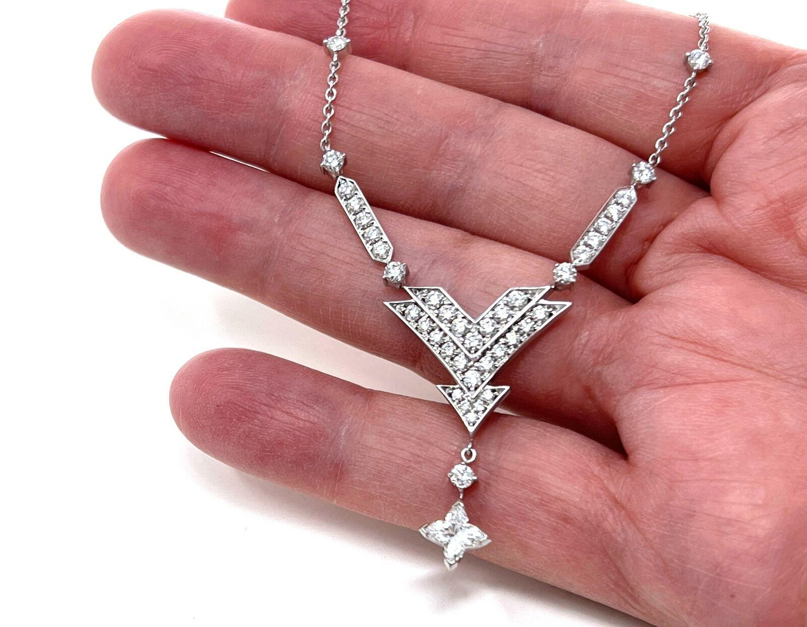This sophisticated authentic necklace is by Louis Vuitton, it is crafted from 18k white gold with a polished finish. The pendant features a star shape diamond decorated large to small triple V frame attached to a single bar above on each end with a