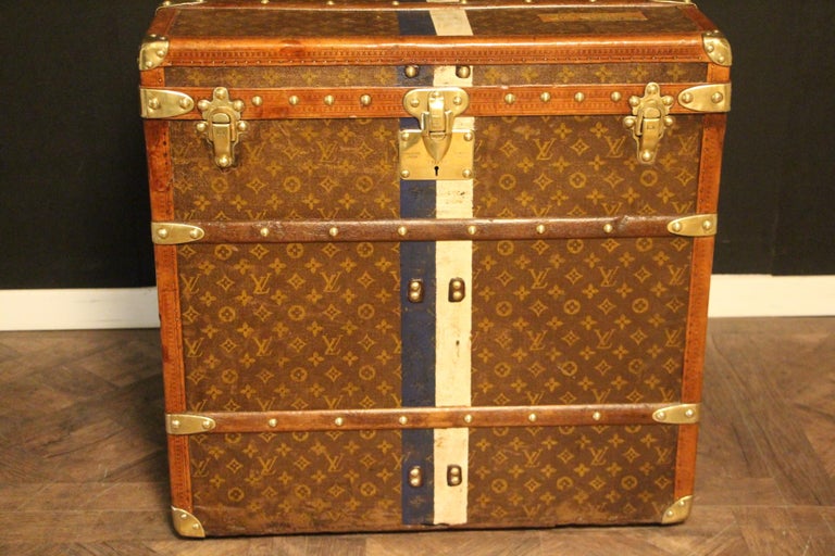 This unusual cube trunk is very elegant and in good condition. It features the stenciled LV monogram pattern canvas, lozine trim, Louis Vuitton stamped brass locks, LV stamped studs and leather side handles. It false eatures a custom made painted