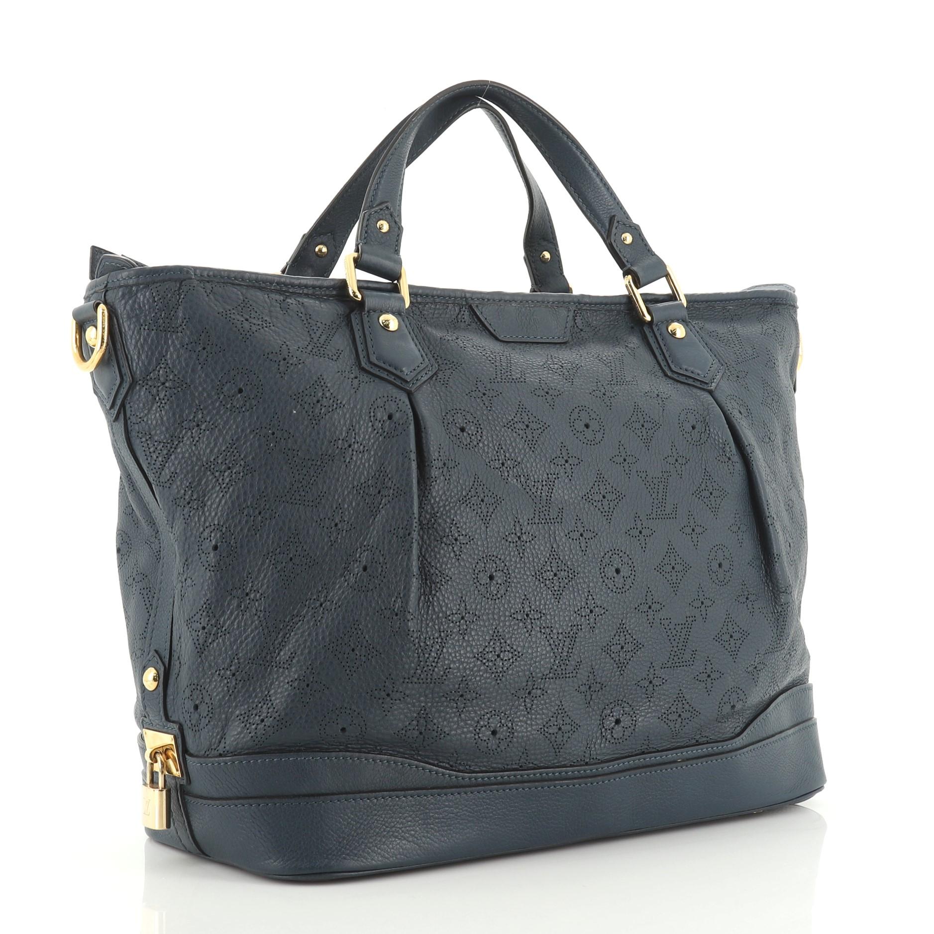This Louis Vuitton Stellar Handbag Mahina Leather GM is your everyday bag that displays understated simplicity and elegance with versatile functionality made for the modern woman. Crafted from blue perforated mahina leather, features dual flat