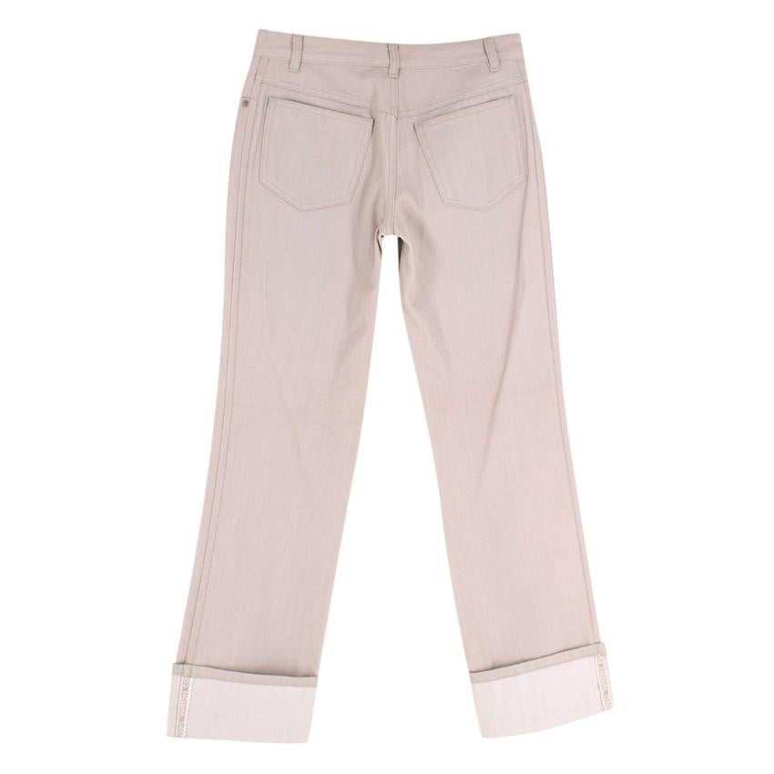 Louis Vuitton Stone Wool Twill Jeans
 

 - Jean-style wool twill trousers in stone coloured hue
 - Produced as part of a limited edition collection celebrating the Americas cup 
 - Cuffed ankle with LV signature built into the selvedge
 - 5 pocket