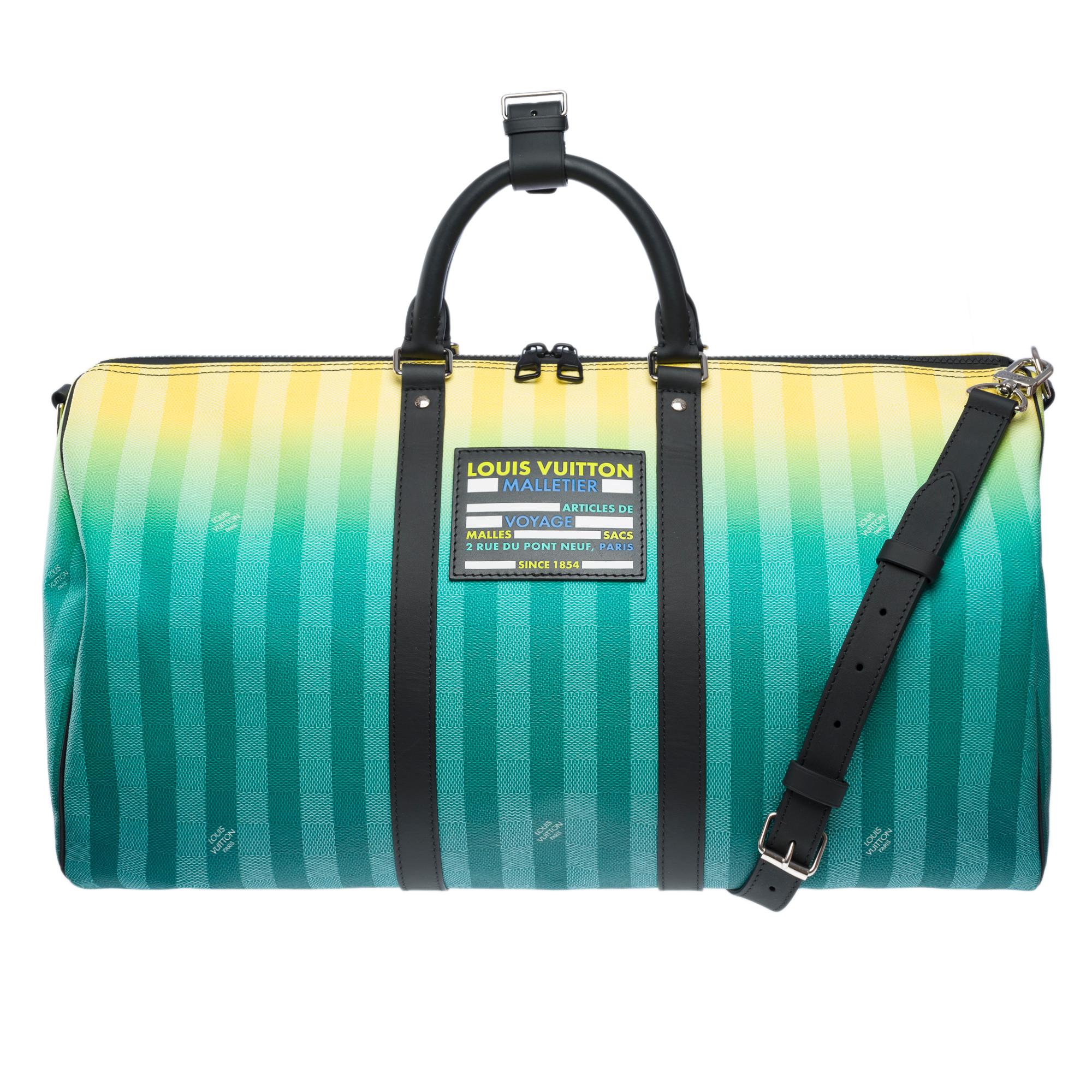 Superb​ ​Keepall​ ​50​ ​Travel​ ​bag​ ​strap​ ​in​ ​striped​ ​and​ ​damier​ ​coated​ ​canvas​ ​in​ ​Turquoise,​ ​Green,​ ​and​ ​Yellow​ ​with​ ​silver​ ​metal​ ​hardware,​ ​removable​ ​adjustable​ ​black​ ​leather​ ​shoulder​ ​strap,​ ​and​ ​black​