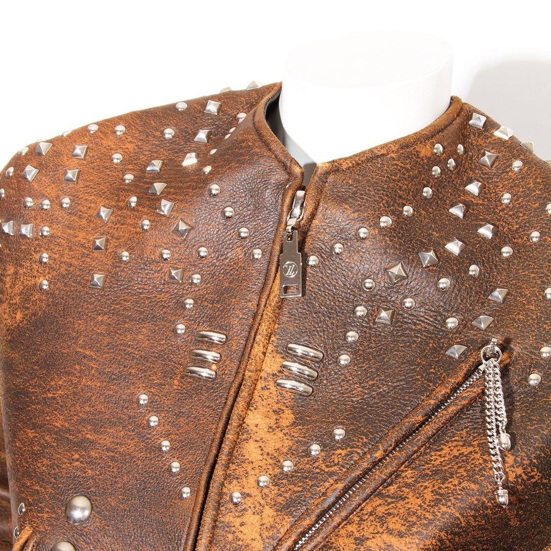 Studded leather jacket by Louis Vuitton 
Circa 2017
Brown leather
Silver-tone hardware
Stud details
4 zip pockets
1 snap pocket
Longsleeve 
Silk lining
Oversized belt loops
Made in Italy
Condition: Great, little to no visible wear. (see photos)