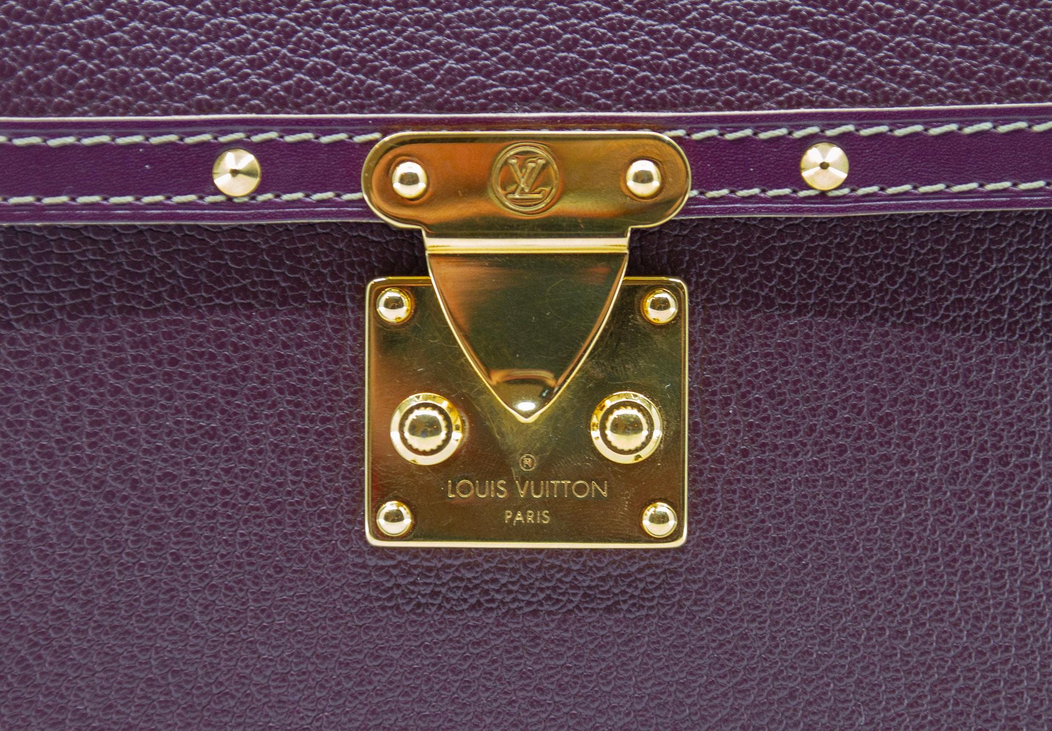 Louis Vuitton Top Handle Bag, 2004 Collection. Maroon. Gold-tone Hardware, Flat Handle, Canvas Lining. Push lock closure at front, protective feet at base. Includes Dust Bag.

Height: 5.75
