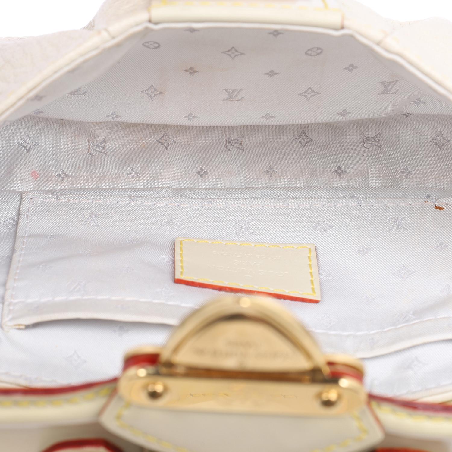 Authentic, pre loved Louis Vuitton beige Suhali leather shoulder bag. Features brass hardware, removable shoulder strap, studded accents, jacquard lining, single interior pocket, push-lock closure at front.

Authenticity date code: AR1057 Made in