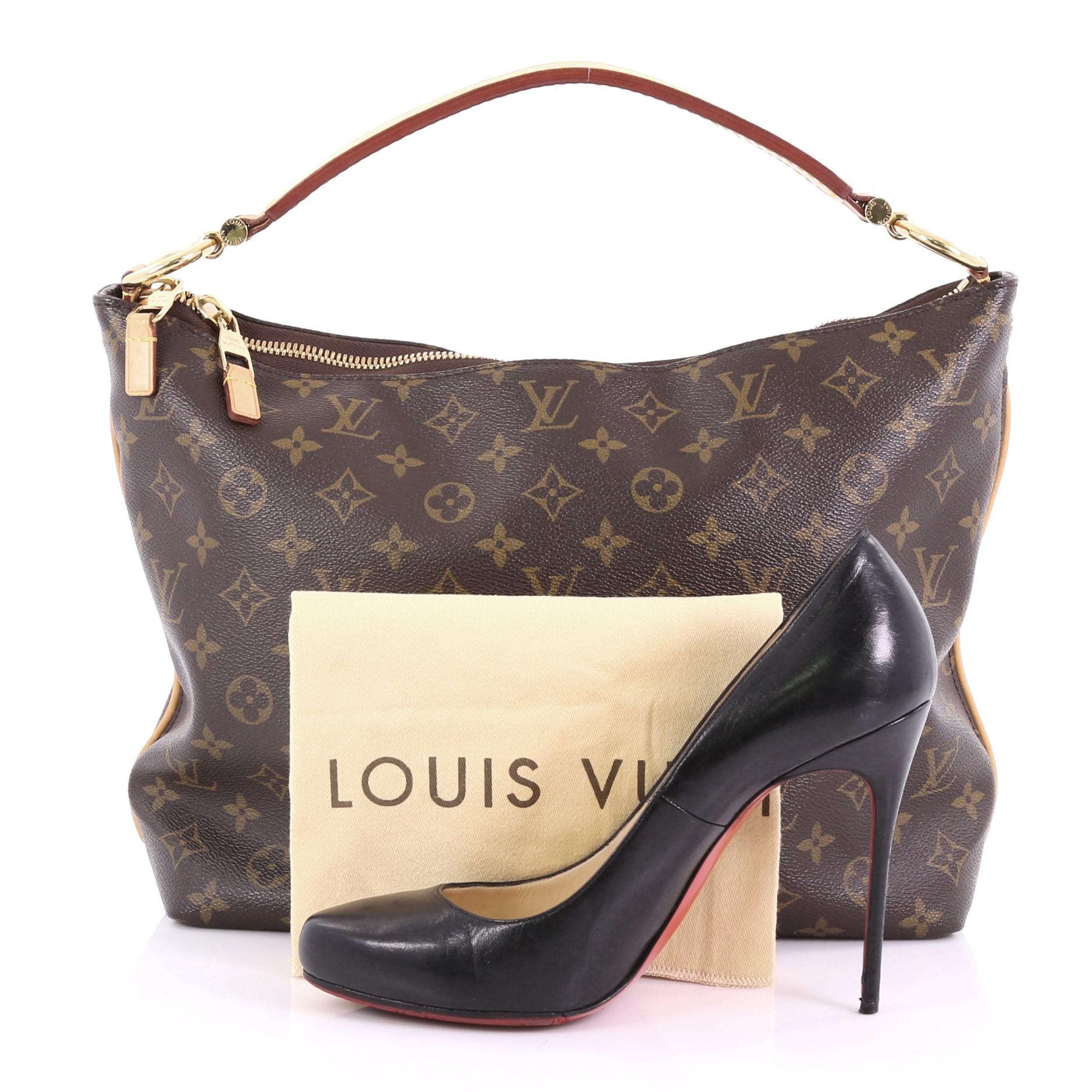 This Louis Vuitton Sully Handbag Monogram Canvas PM, crafted from brown monogram coated canvas, features a thick vachetta cowhide looped strap and gold-tone hardware. Its two-way top zip closure opens to a brown fabric interior with slip pockets.