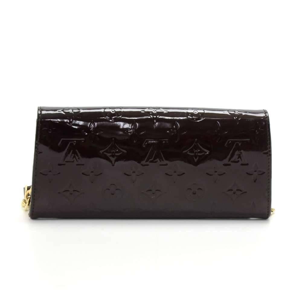 Louis Vuitton Vernis Leather Clutch Wallet. The flap is secured with magnetic closure. Inside has an open space for your bills, notes, reciepts, 1 zipper pocket for your coins, and 6 card slots. It can be used as hand bag or just as a wallet. Can be