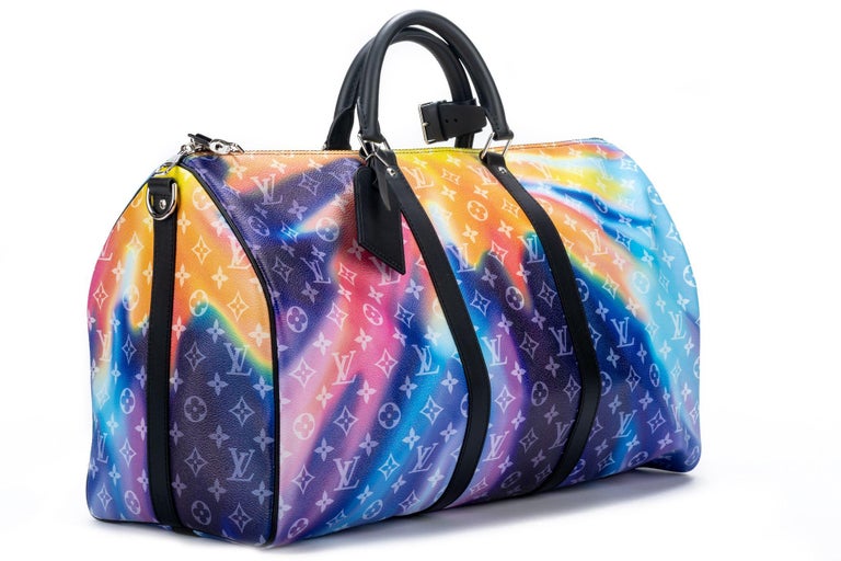 Louis Vuitton Virgil Abloh Multicolor Monogram Sunset Coated Canvas Keepall 50 with silver hardware from 2021. This bag is lined with black fabric. It comes with a shoulder strap (16.5'drop), a luggage tag, lock, keys, dustbag and the original box.
